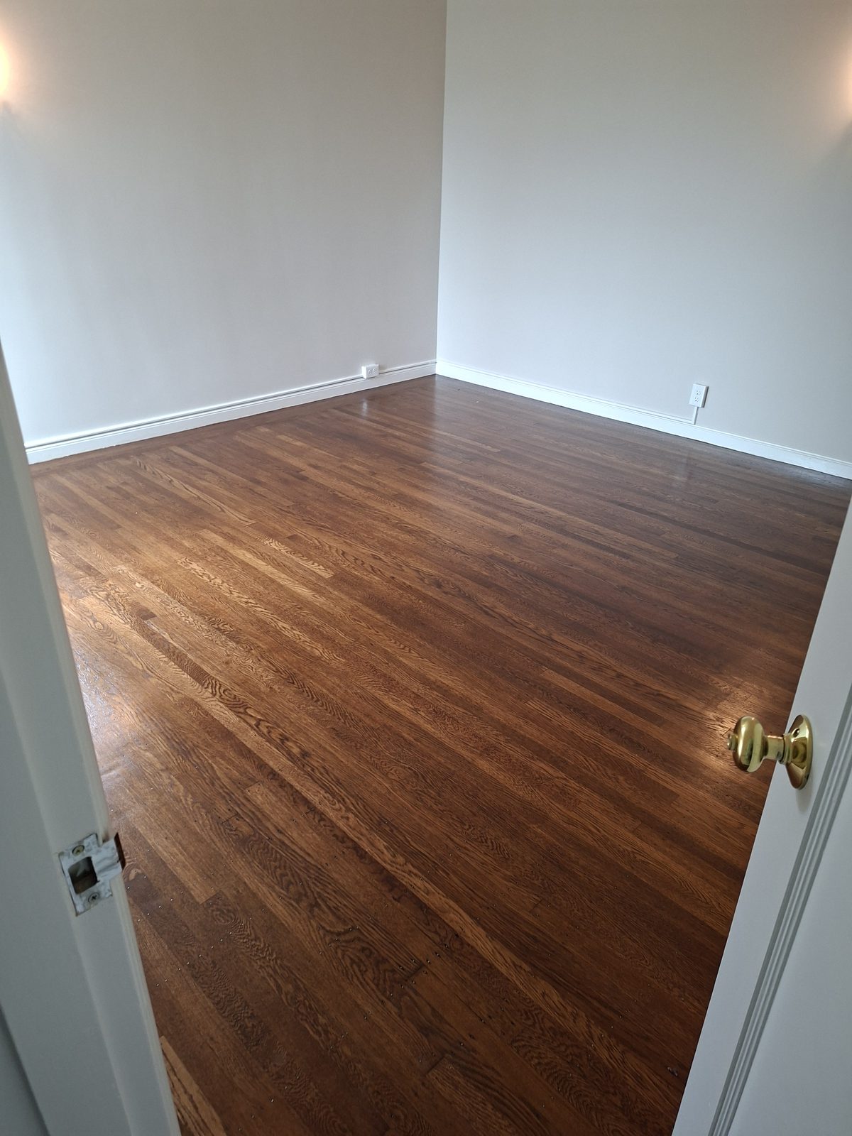 Restored bedroom with refinished hardwood floors in a Noe Valley Victorian