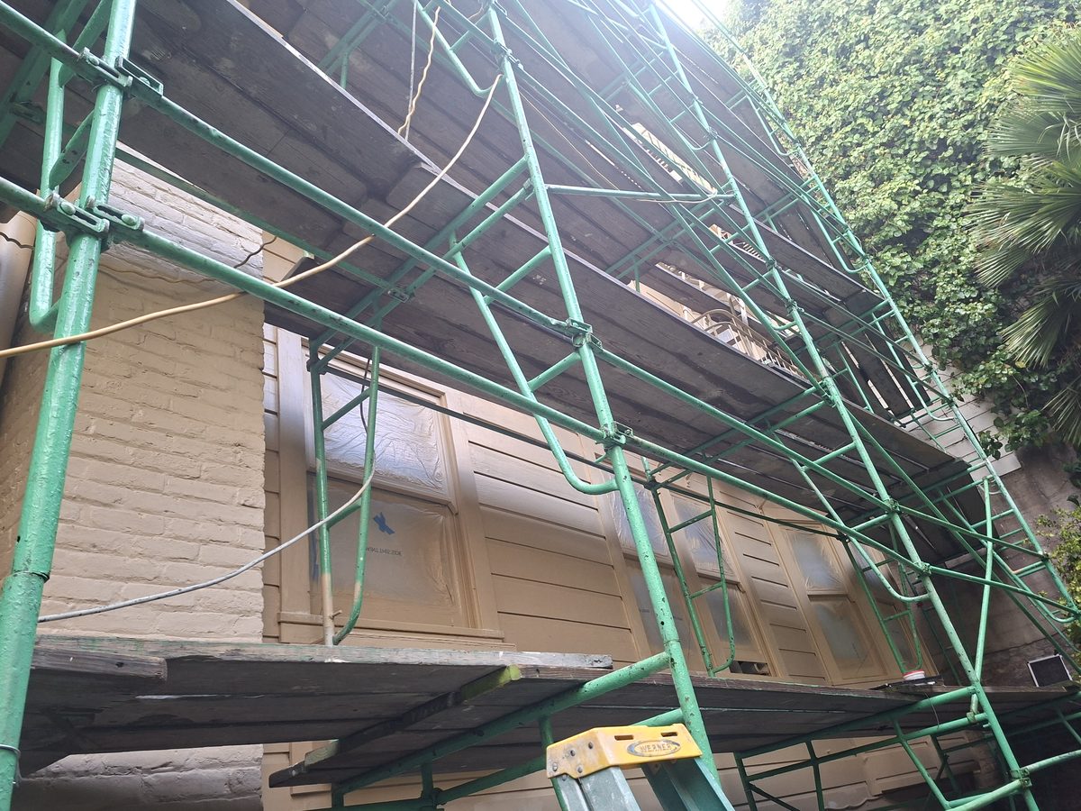 Sunset District home during full exterior repaint with scaffolding in place for proper prep