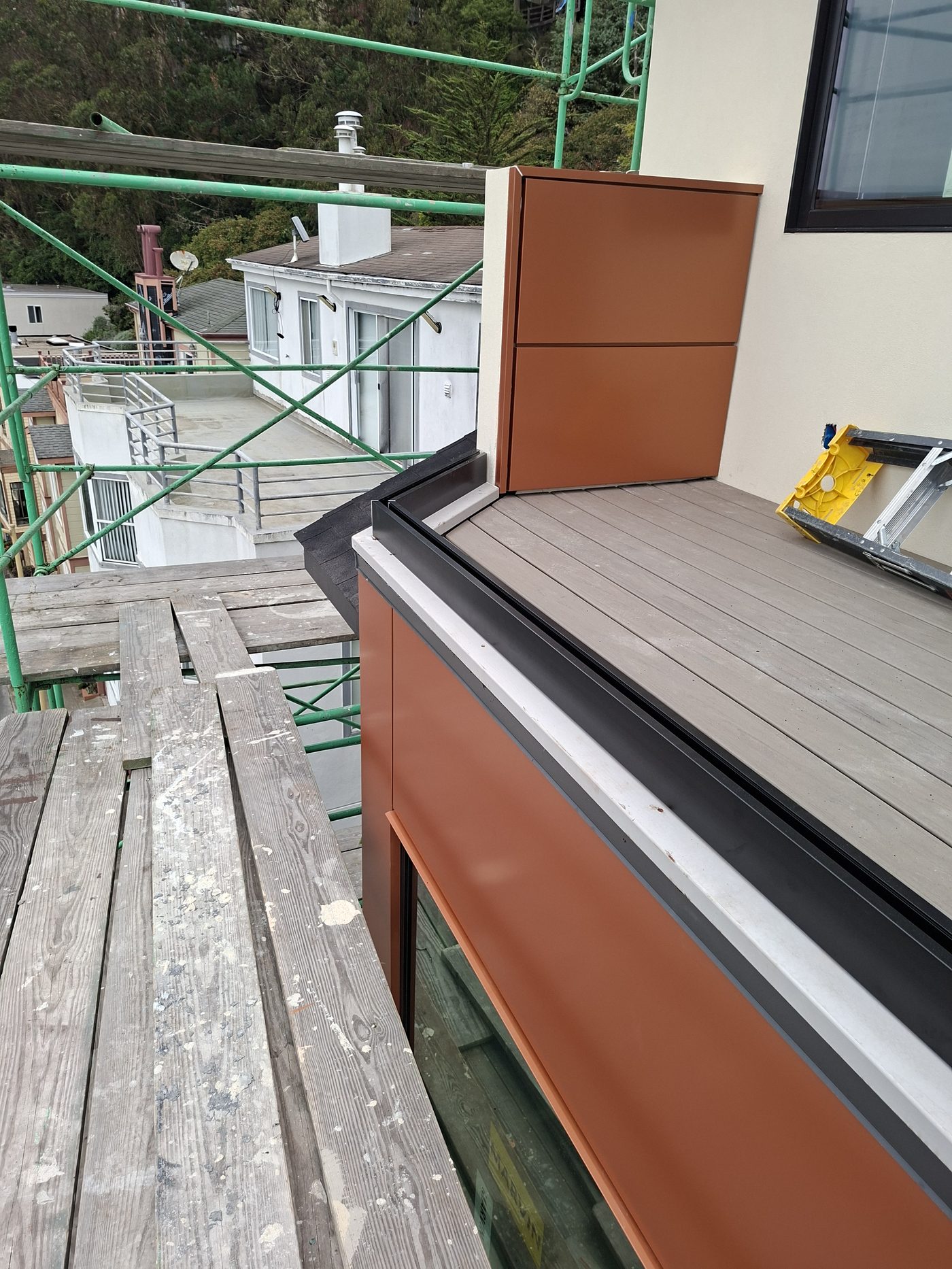 Modern fiber cement siding installation with copper accent panel detail
