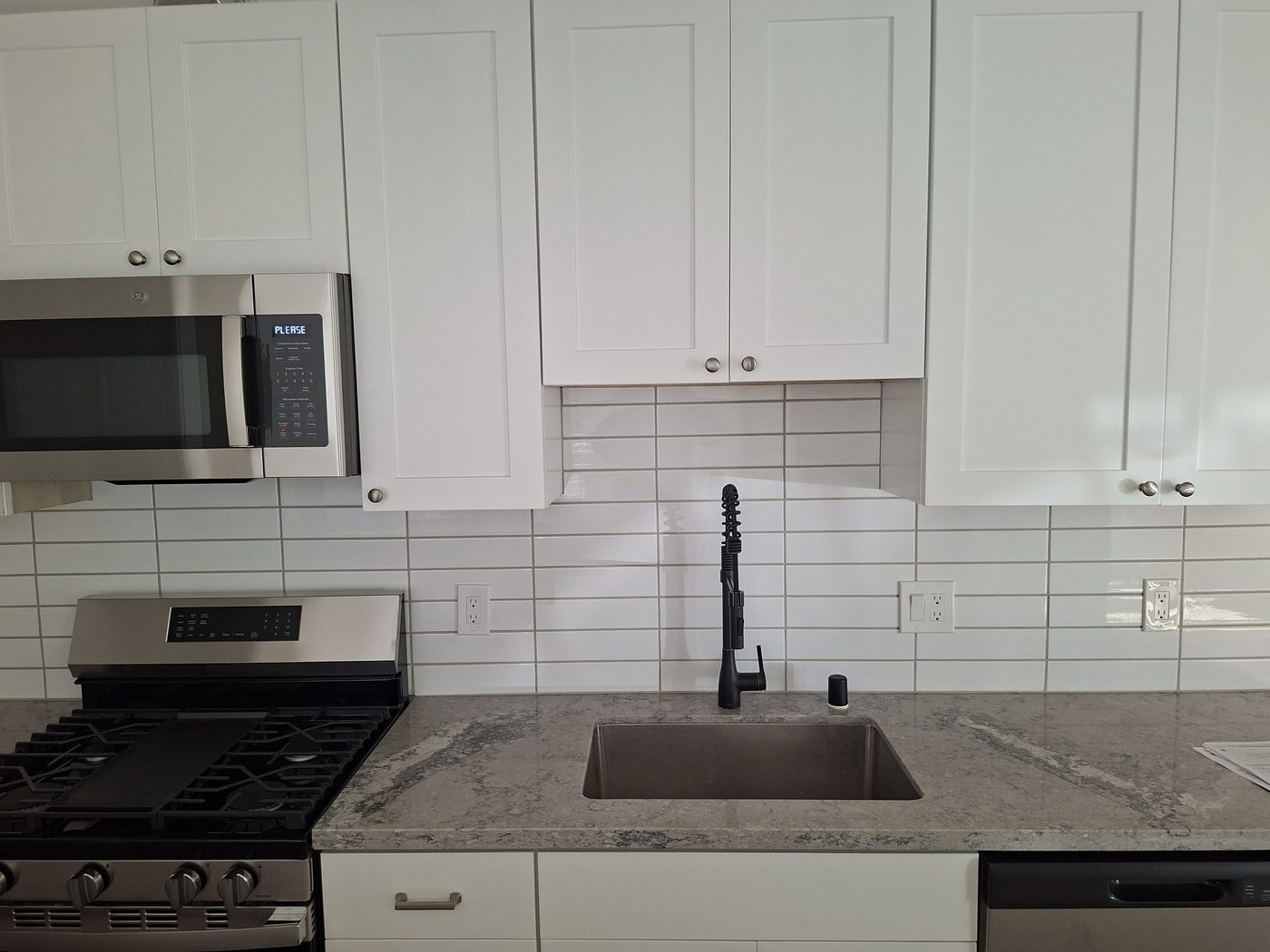 Newly installed window above a kitchen sink in a remodeled San Francisco home